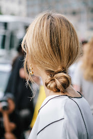 danish blogger Pernille Teisbaek at NYFW with a low loose knot hair style
