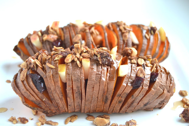 Stuffed Hasselback Sweet Potatoes- loaded with sweet apples, dried cherries, pecans, maple syrup and protein granola for breakfast or dessert! www.nutritionistreviews.com