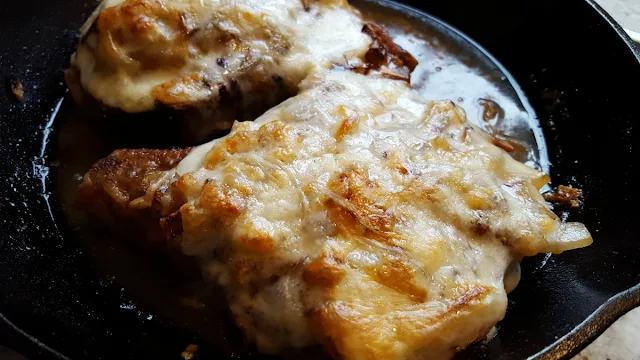 Pork Chops with Onions and Provolone Cheese.