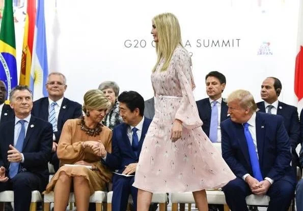 Queen Maxima wore a dress by Natan. Ivanka Trump wore Valentino Snowdrop print silk midi dress. Justin Trudeau