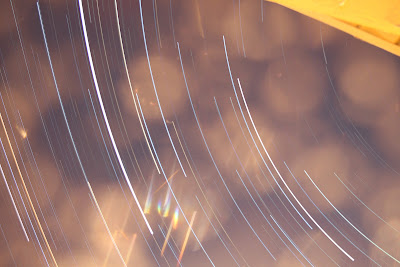 star trails with lens flare