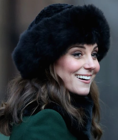 Kate Middleton wore a new bespoke Catherine Walker coat and dress. Duchess accessorised her coat with a faux fur collar and faux fur cuffs from Troy London