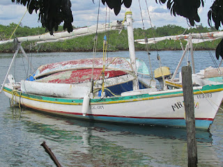 Belizean fishing smack with 5 dugout canoes aboard