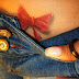 Art Tattoo feminina virilha laço