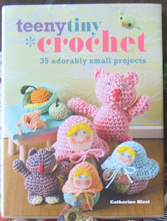 Front cover of book "Teeny Tiny Crochet" by Catherine Hirst.