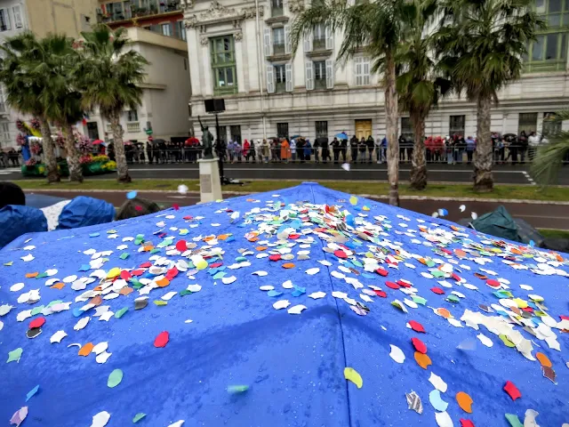 Confetti on an umbrella at the Nice Carnival flower parade