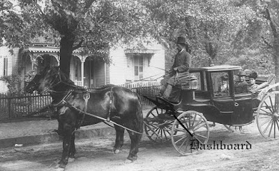 A picture of a fancy old horse-drawn carriage, with the dashboard called out at the driver's feet.