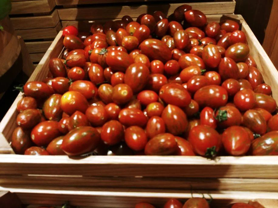 Fresh and bright red cherry tomatoes at The Grand Kitchen