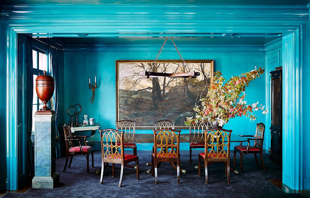 Dramatic peacock blue paintcolor in dining room by Ken Fulk