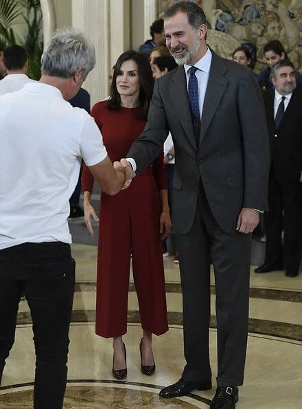 Queen Letizia wore Hugo Boss Trima cropped wide-leg trousers and Hugo Boss Frankie cuff-detail wool sweater. King Felipe and Queen Letizia