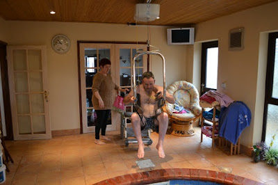 Jason Miller self hoists using the body support system in order to access his swimming pool and hot tub