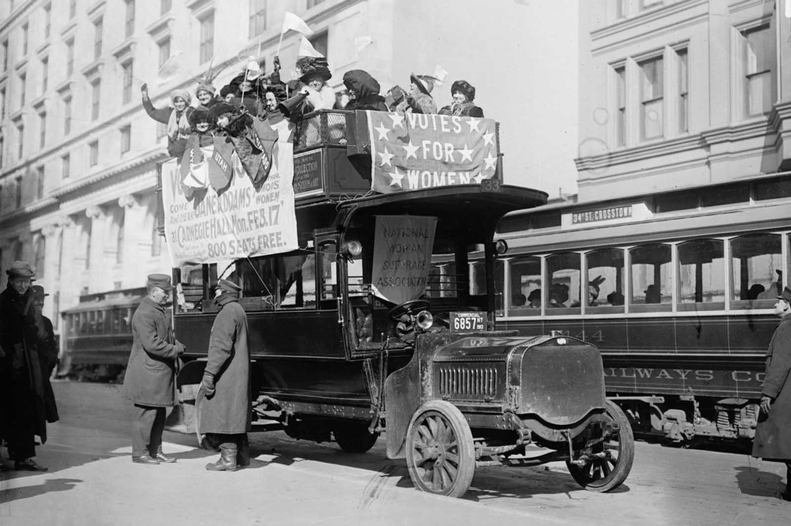 Suffragists on bus in New York City, part of the suffrage hike to Washington, District of Columbia, which joined the March 3, 1913 National American Woman Suffrage Association parade.
