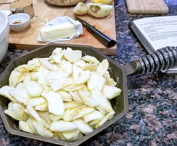 add sliced apples to cast iron skillet