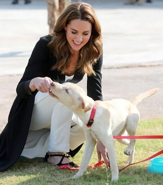 Kate Middleton wore a Kurta by Elan, one of Pakistan's leading design houses. Kate wore a crossover flat shoes by Russell and Bromley