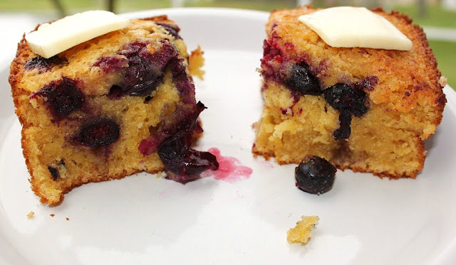 this is blueberry cornbread baked in a pan with butter on top