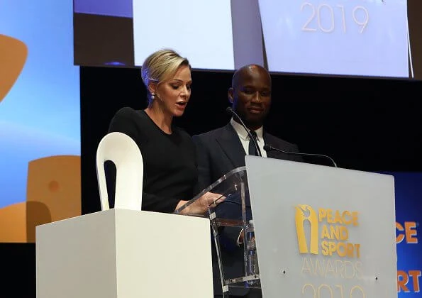 Prince Albert, Princess Charlene and Pierre Casiraghi attended the award ceremony. Princess Charlene in Ralph Lauren dress