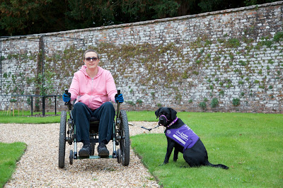 Photo of me sitting in my mountain trike and Liggy sitting on the lawn