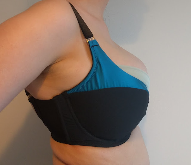 Side view of me wearing the Lottie, showing wide wires and lots of quadboob