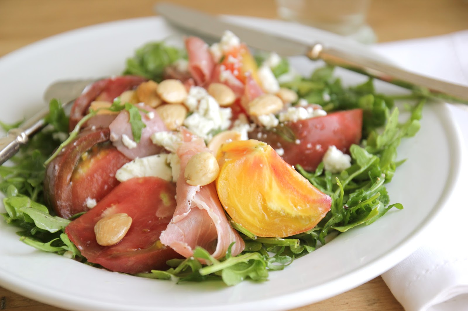 Heirloom Tomato, Marcona Almonds, Prosciutto & Caprine Animal Cheese Salad Amongst An Slow Lemon