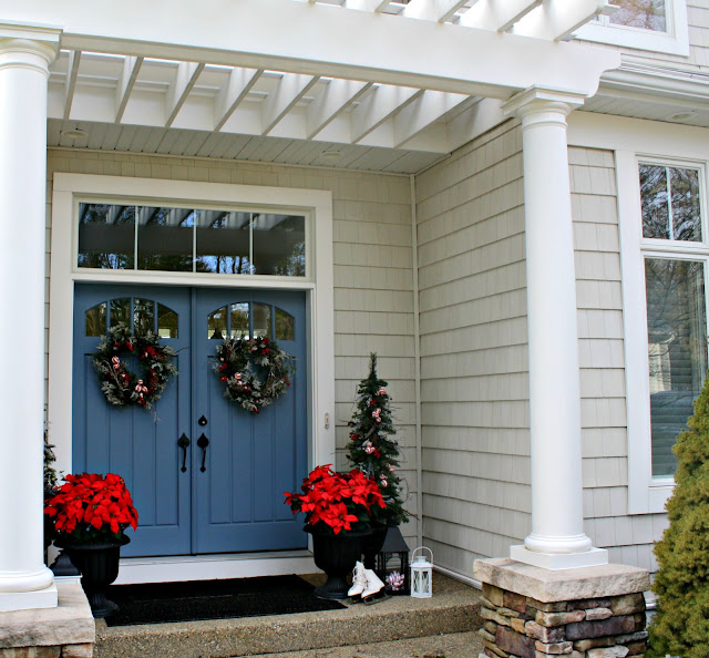 Blue front doors decorated for Christmas