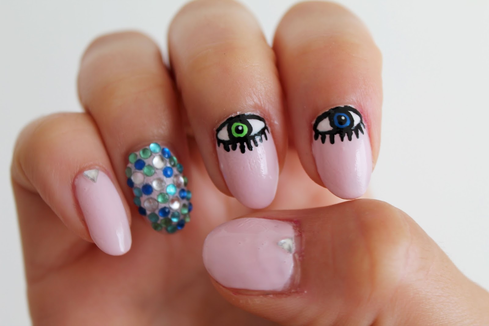 3. Pink and White Evil Eye Nail Design - wide 9