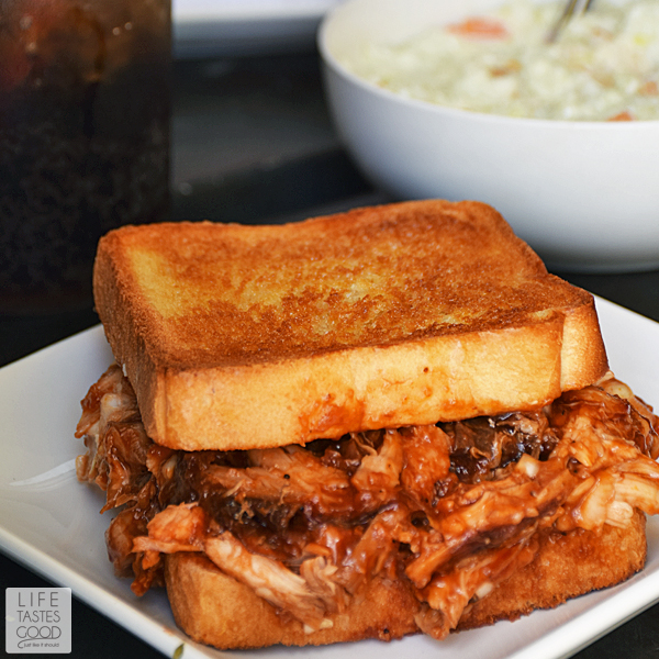 Barbecued Chicken on Garlic Toast | by Life Tastes good | Crisp buttered garlic toast topped with tangy barbecued pulled chicken is a big sandwich so thick you have to open your mouth extra wide to get that first scrumptious bite! #LTGRecipes #EffortlessMeals