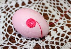 Wrapping eggs with thread