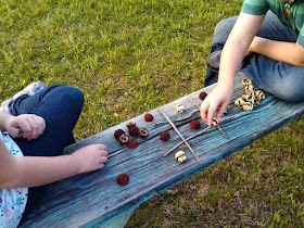 Make an eco friendly tic tac toe game from found objects.