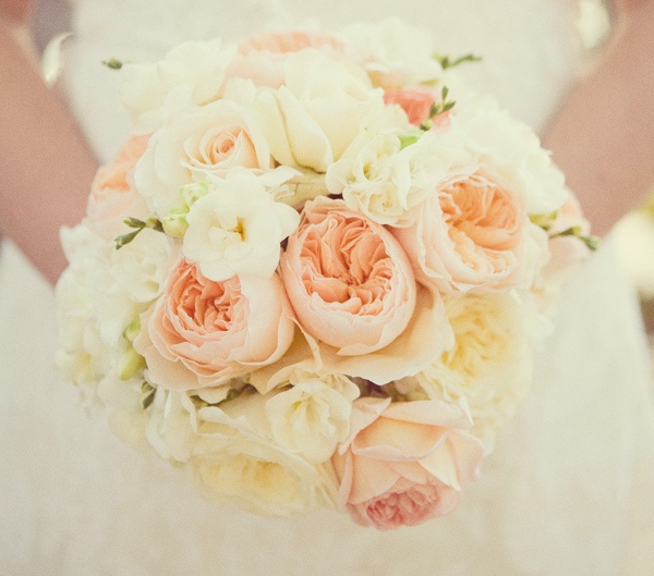 Lots and lots of cream and blush pink or peach roses and peonies super 