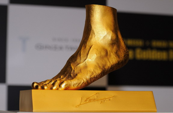Golden statue of the left foot of Lionel Messi is displayed at the launching at Harajuku Quest Hall