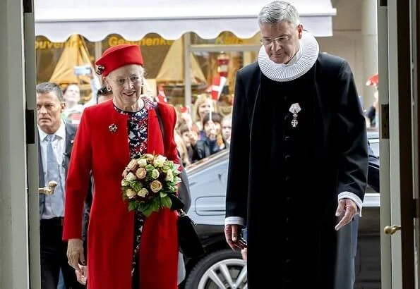 The Queen arrived at Flensburg Harbour with the Royal Ship Dannebrog. Hale Bob red outifit floral print dress