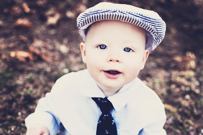 A little boy wearing a hat