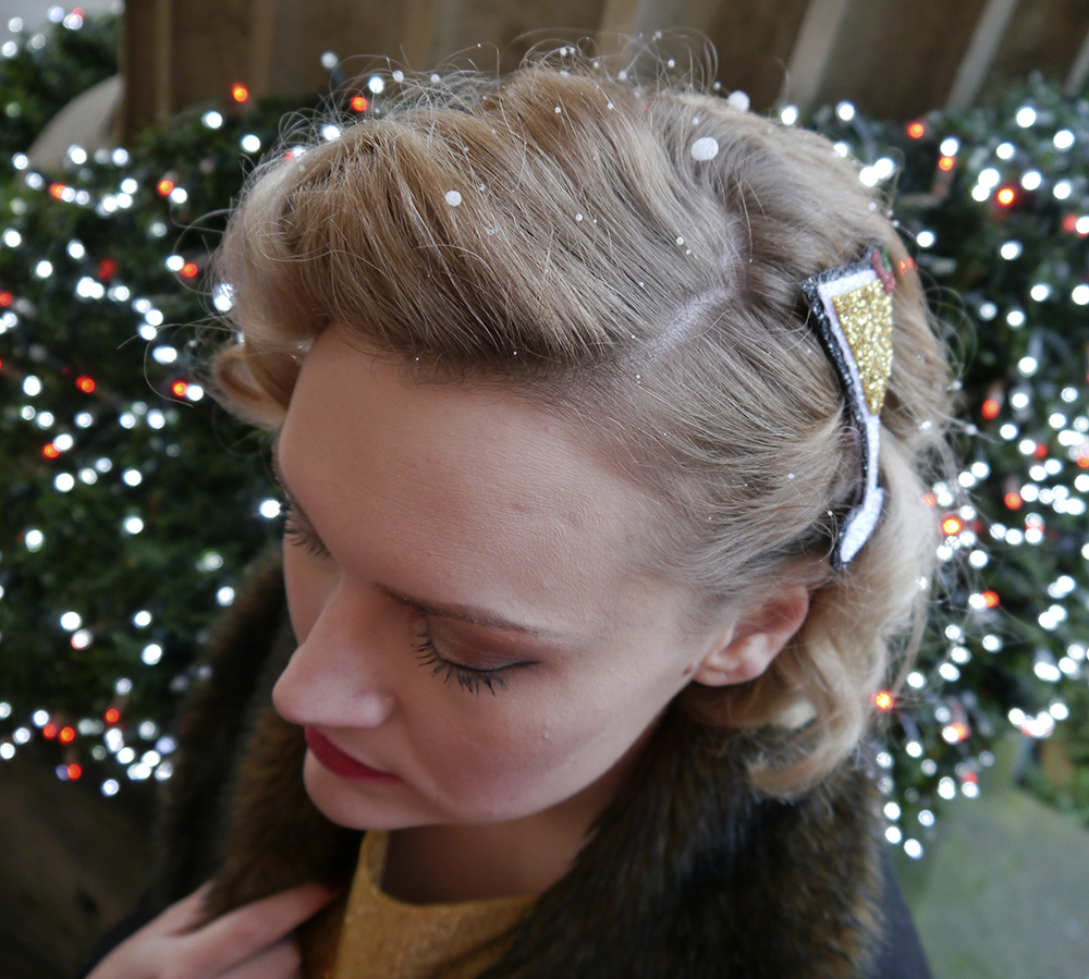Vintage pincurls with a christmas twist British vintage style blogger, faux fur trimmed Henry Holland coat, gold glitter clutch for christmas party, easy vintage pincurl style with tongs, fashion blogger christmas outfit, alternate normality cocktail hair accessory