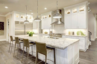 Beautiful Light Filled Kitchen With White Countertops