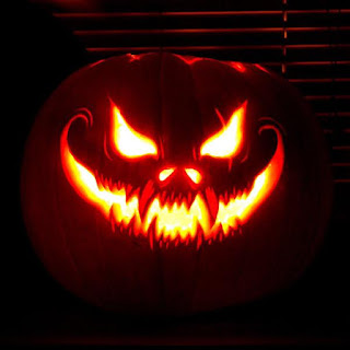 Jack o lantern with face blazing from inner candle