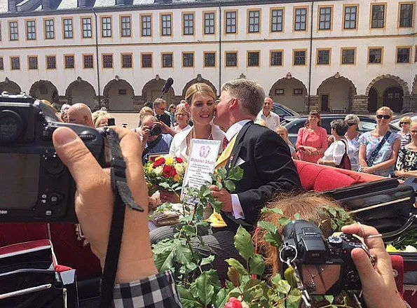 Princess Stephanie of Saxe-Coburg and Gotha wore a white silk wedding dress from German fashion designer Gordon Sieverding, who is based in Michelau