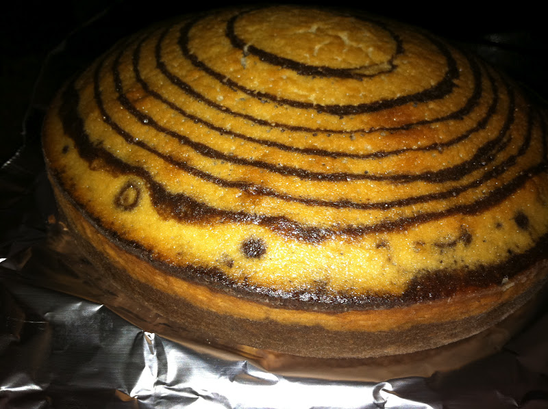 The Sizzling Pan "Pat a Cake" Zebra Cake with Chocolate Whipped Cream frosting