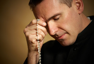 Praying priest image
