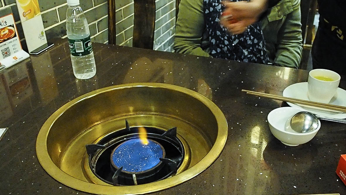 Gas burner for hotpot built into a table