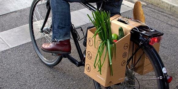 bicycle career made up of cardboard, vegetable fruits backside carrier