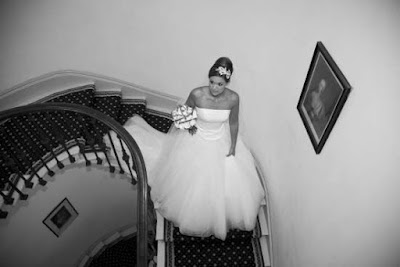 Bride on the spiral staircase at Wynyard Hall