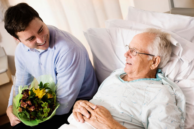 Man visiting his father in the hospital