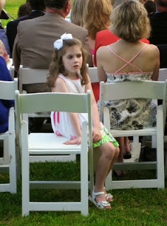 Is she thinking, This wedding's not interesting?