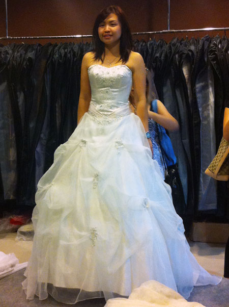 After trying out countless gowns I settled for this ivory white poofy gown