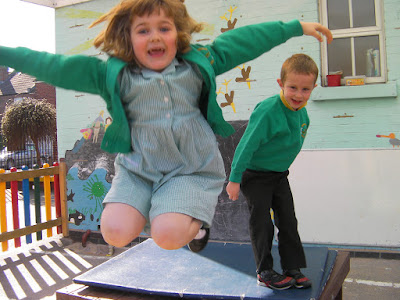 jumping in the playground in school uniform