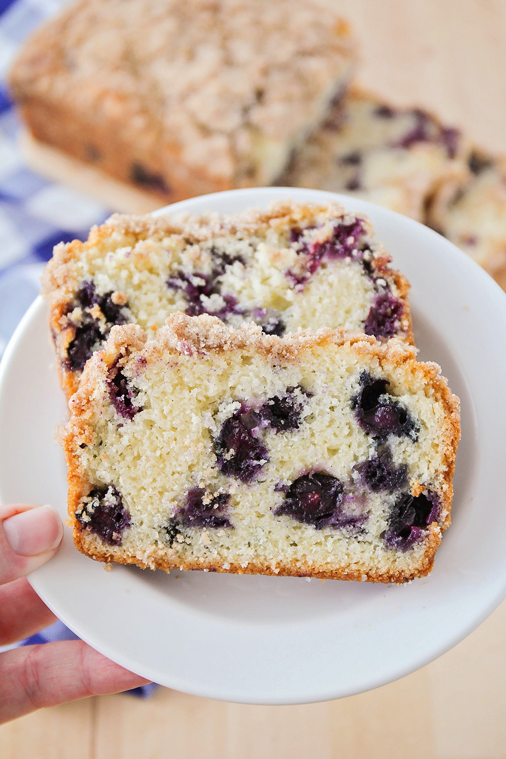 This blueberry muffin bread is so tender and sweet, and topped with a delicious buttery streusel. Perfect for breakfast or dessert!