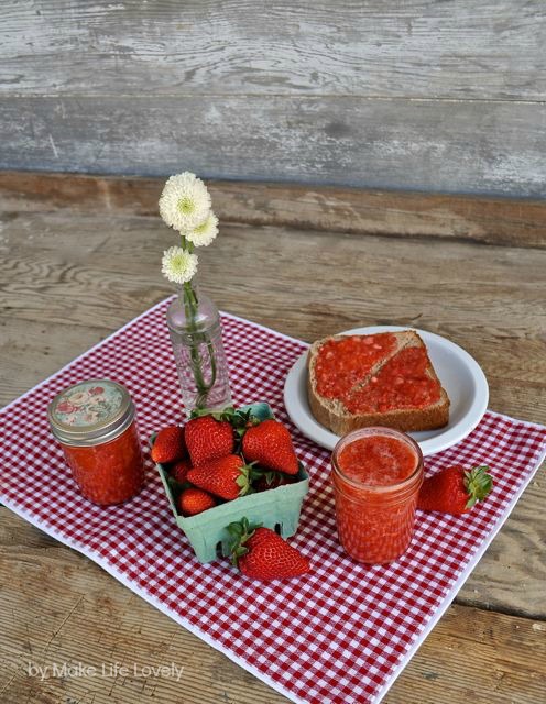 strawberry jam in jar and on piece of toast