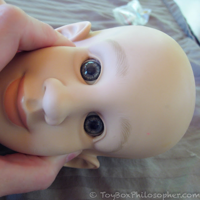 squished baby doll head