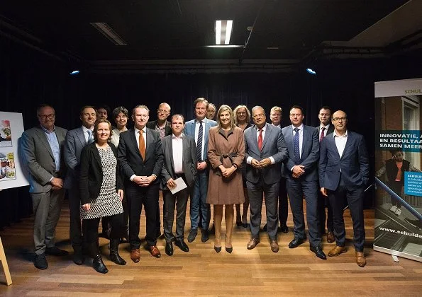 Queen Maxima met with people during a working visit to Schuldenlab070 (Debt Lab070) in The Hague.Natan dress