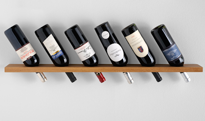 wall-mounted wine rack, like a shelf with holes in it, where necks get inserted